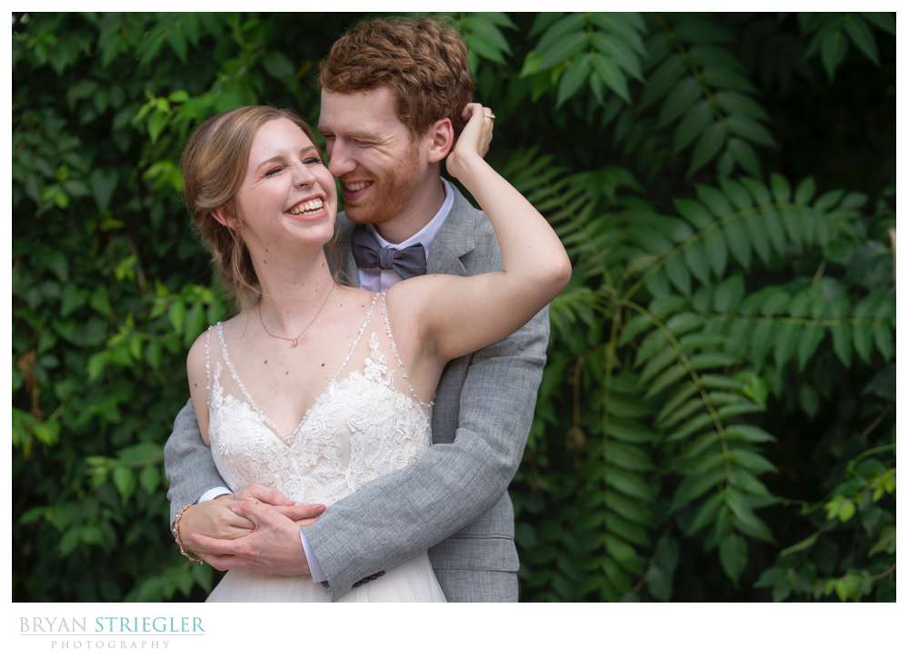 groom hugging bride